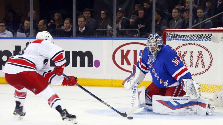 Henrik Lundqvist of the New York Rangers makes a save in the second period against Nathan Gerbe of the Carolina Hurricanes at Madison Square Garden on Tuesday, Nov. 10, 2015.