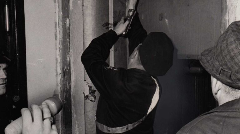 Emergency police work to free passengers stuck in an elevator in a building on East 32nd street during the blackout on November 9, 1965.