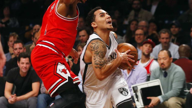 Nets vs. Bulls 30 Shane Larkin #0 of the Brooklyn Nets drives past Derrick Rose #1 of the Chicago Bulls for a basket in the first half at Barclays Center on Wednesday, Oct. 28, 2015 in Brooklyn, New York.