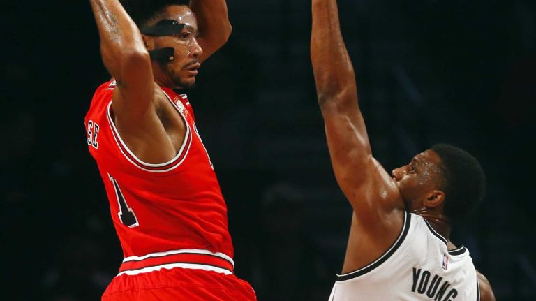 Nets vs. Bulls 41 Derrick Rose #1 of the Chicago Bulls looks for a teammate in the first half against Thaddeus Young #30 of the Brooklyn Nets at Barclays Center on Wednesday, Oct. 28, 2015 in Brooklyn, New York.
