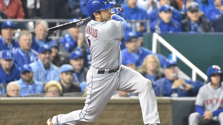 World Series Game 2: Mets vs. Royals 55 New York Mets catcher Travis d'Arnaud (7) hits into a double play in second inning during Game 2 of the World Series against the Kansas City Royals at Kauffman Stadium on Wednesday, Oct. 28, 2015.