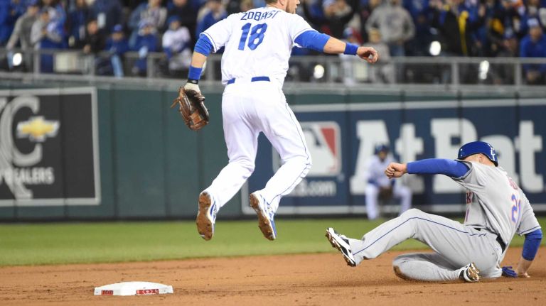 World Series Game 2: Mets vs. Royals 56 New York Mets first baseman Lucas Duda (21) is out at 2nd base as Kansas City Royals second baseman Ben Zobrist (18) gets out of the way in second inning during Game 2 of the World Series against the Kansas City Royals at Kauffman Stadium on Wednesday, Oct. 28, 2015.