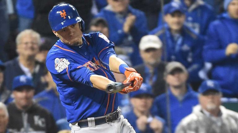 World Series Game 1: Mets vs. Royals 87 New York Mets shortstop Wilmer Flores (4) hits an RBI single in the eighth inning during Game 1 of the World Series against the Kansas City Royals at Kauffman Stadium on Tuesday, Oct. 27, 2015.