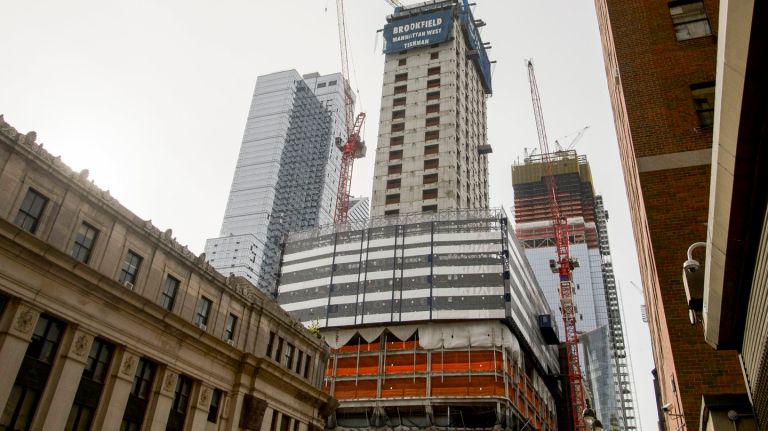 Construction workers fall from boom lift at midtown building; 1 dead, 1 injured, police say 1 The location where a construction worker died and another was seriously injured Thursday afternoon when the pair fell from an external elevator shaft fell about 35 feet from the building at 401 Ninth Ave in Manhattan, Thursday, Sept. 21, 2017. A 45-year-old worker was pronounced dead at the scene and the other worker, also 45, was rushed to Bellevue Hospital Center in serious but stable condition, according to a NYPD spokeswoman.
