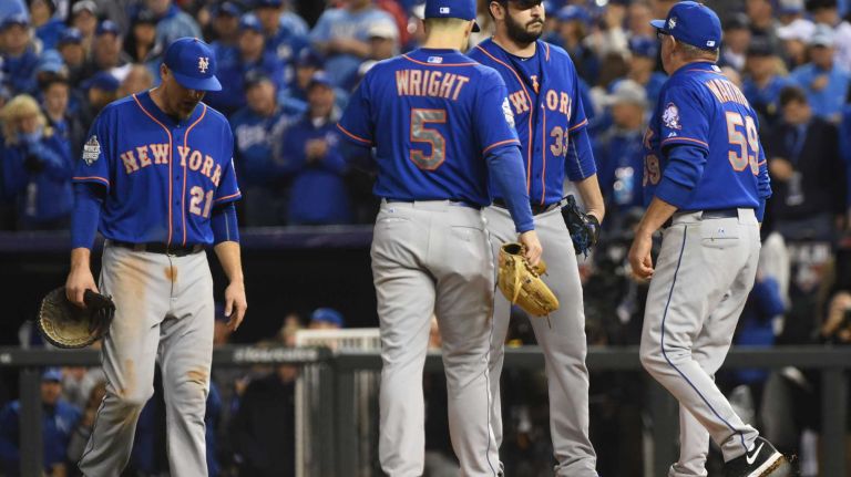 World Series Game 1: Mets vs. Royals 95 New York Mets first baseman Lucas Duda (21) and New York Mets third baseman David Wright (5) go to the mound as New York Mets pitching coach Dan Warthen (59) goes to talk with New York Mets starting pitcher Matt Harvey (33) in the sixth inning during Game 1 of the World Series against the Kansas City Royals at Kauffman Stadium on Tuesday, Oct. 27, 2015.
