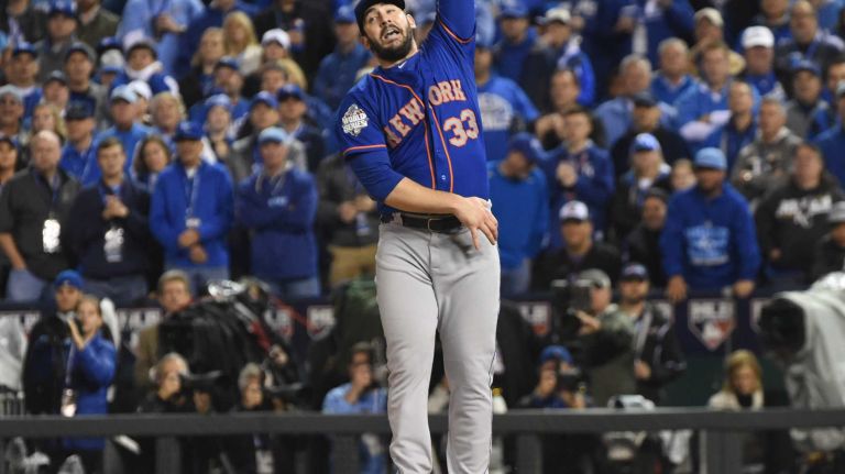 World Series Game 1: Mets vs. Royals 96 New York Mets starting pitcher Matt Harvey (33) jumps in vain as Kansas City Royals third baseman Mike Moustakas (8) gets rbi single in the sixth inning during Game 1 of the World Series against the Kansas City Royals at Kauffman Stadium on Tuesday, Oct. 27, 2015.