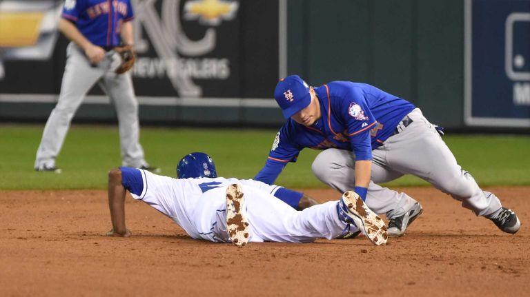 World Series Game 1: Mets vs. Royals 98 New York Mets shortstop Wilmer Flores (4) is late with tag as Kansas City Royals center fielder Lorenzo Cain (6) gets back to 2nd base in sixth inning during Game 1 of the World Series against the Kansas City Royals at Kauffman Stadium on Tuesday, Oct. 27, 2015.
