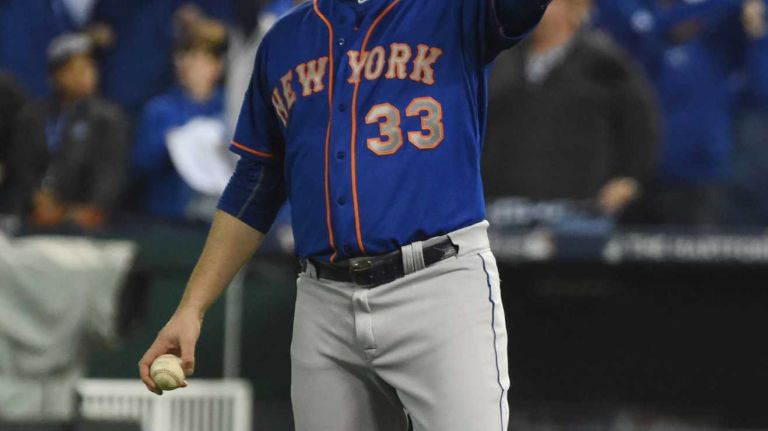 World Series Game 1: Mets vs. Royals 118 New York Mets starting pitcher Matt Harvey (33) reacts to the inside the park homerun by Kansas City Royals shortstop Alcides Escobar (2) in first inning during Game 1 of the World Series against the Kansas City Royals at Kauffman Stadium on Tuesday, Oct. 27, 2015.