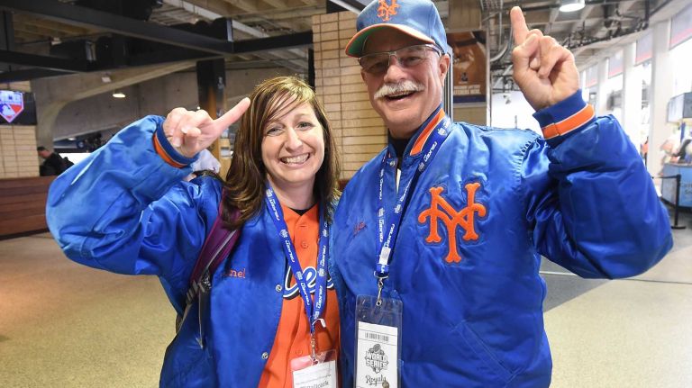 World Series Game 1: Mets vs. Royals 133 Jenel Nels LaClaire, IA and Steven Bernstein of St. Louis, MO are ready to cheer on the Mets during Game 1 of the World Series against the Kansas City Royals at Kauffman Stadium on Tuesday, Oct. 27, 2015.
