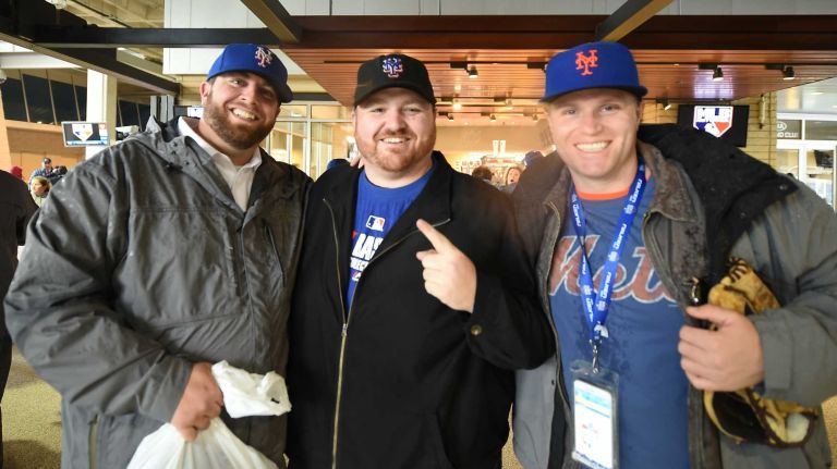 World Series Game 1: Mets vs. Royals 137 Mets and Royals fans Joseph Palombo of Albany, NY with KC Maguire of Bay Area Matt Grolle of Schenectady, NY are all ready during Game 1 of the World Series against the Kansas City Royals at Kauffman Stadium on Tuesday, Oct. 27, 2015.