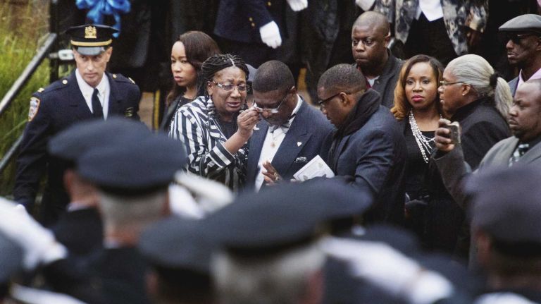 As thousands of men and women in blue paid tribute to the fallen officer at his funeral service in Queens on Wednesday, NYPD Commissioner Bill Bratton announced that Holder would be promoted to detective posthumously. 