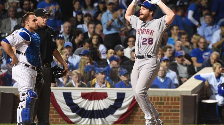 New York Mets second baseman Daniel Murphy (28) reacts in the 8th inning after his homerun during Game 4 of the NLCS against the Chicago Cubs at Wrigley Field on Wednesday, Oct. 21, 2015.