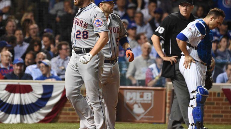 New York Mets second baseman Daniel Murphy (28) reacts in the 8th inning after his homerun during Game 4 of the NLCS against the Chicago Cubs at Wrigley Field on Wednesday, Oct. 21, 2015.