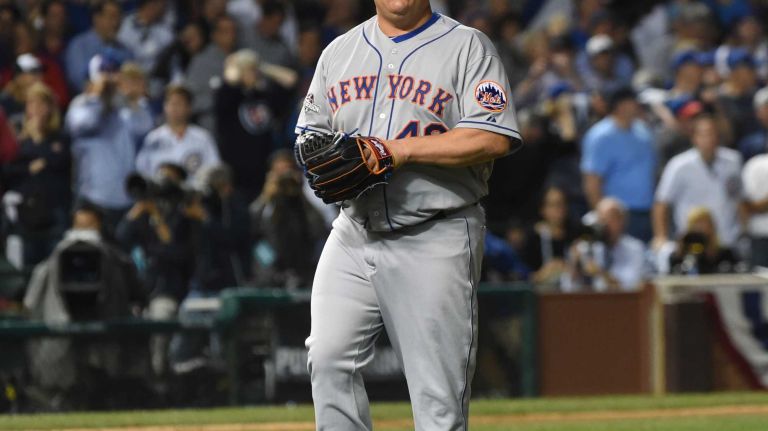 New York Mets starting pitcher Bartolo Colon (40) walks to the dugout after striking out Chicago Cubs third baseman Kris Bryant (17) in fifth inning during Game 4 of the NLCS at Wrigley Field on Wednesday, Oct. 21, 2015.