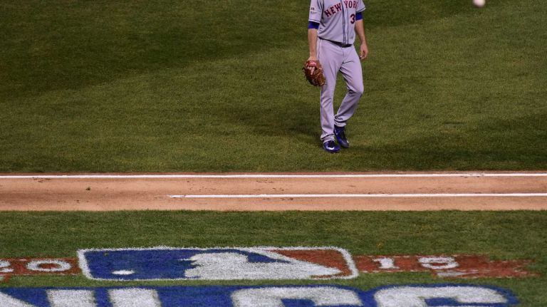New York Mets starting pitcher Steven Matz (32) walks to the dugout after the first inning during Game 4 of the NLCS against the Chicago Cubs at Wrigley Field on Wednesday, Oct. 21, 2015.