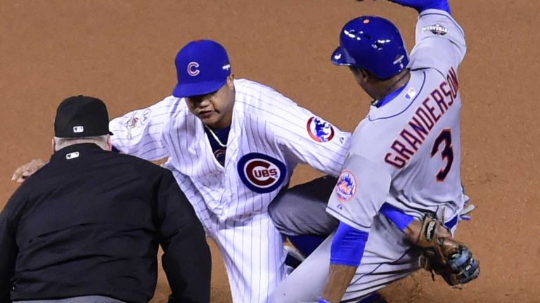 New York Mets rightfielder Curtis Granderson (3) is safe stealing second base as Chicago Cubs shortstop Starlin Castro (13) is late with the tag in the first inning during Game 4 of the NLCS against the Chicago Cubs at Wrigley Field on Wednesday, Oct. 21, 2015.
