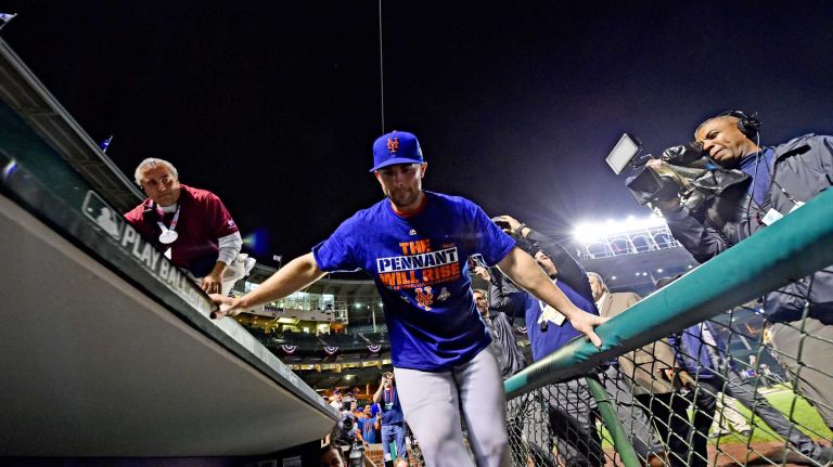 David Wright celebrates on the field after winning Game 4 of the NLCS against the Chicago Cubs at Wrigley Field on Wednesday, Oct. 21, 2015.