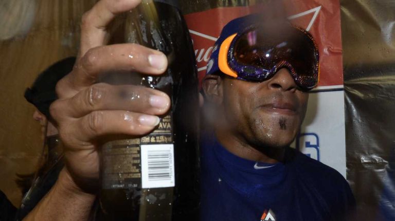 New York Mets centerfielder Yoenis Cespedes celebrates with champagne in the clubhouse after beating the Chicago Cubs in the NLCS at Wrigley Field on Wednesday, Oct. 21, 2015.