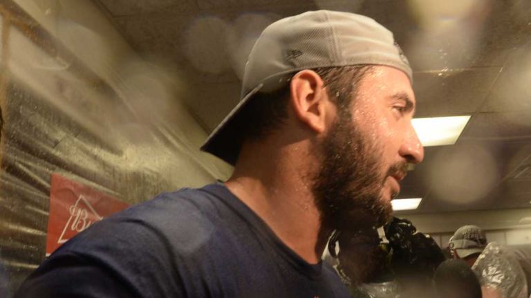 New York Mets starting pitcher Matt Harvey (33) celebrates with champagne after the Mets beat the Chicago Cubs in the NLCS at Wrigley Field on Wednesday, Oct. 21, 2015.