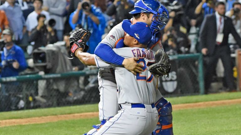 New York Mets closer Jaueyr Familia and catcher Travis d'Arnaud celebrate their NLCS victory over the Chicago Cubs at Wrigley Field on Wednesday, Oct. 21, 2015.