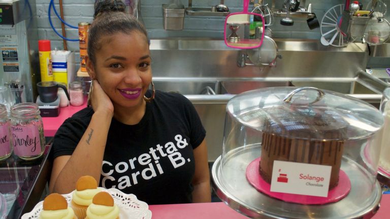 IM Pastry Studio, which recently opened a stall in the Essex Street Market, sells cupcakes, cakes and cake pops named after female celebrities. (Pictured: Tiffany Washington, with Oprah cupcakes and Solange cake)