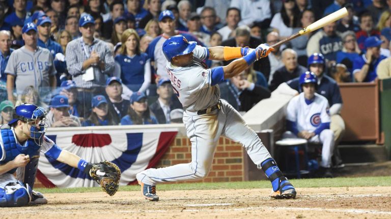 NLCS Game 3: Mets vs. Cubs 40 New York Mets centerfielder Yoenis Cespedes hits an RBI single in the seventh inning during Game 3 of the NLCS against the Chicago Cubs at Wrigley Field on Tuesday, Oct. 20, 2015.