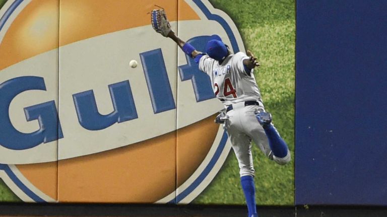 Chicago Cubs center fielder Dexter Fowler (24) cannot get to the New York Mets third baseman David Wright (5) double in the first inning during Game 2 of the NLCS against the New York Mets at Citi Field on Sunday, Oct. 18, 2015.