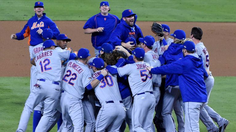 The New York Mets celebrate their National League Division Series victory over the Los Angeles Dodgers at Dodger Stadium in Los Angeles on Oct. 15, 2015.