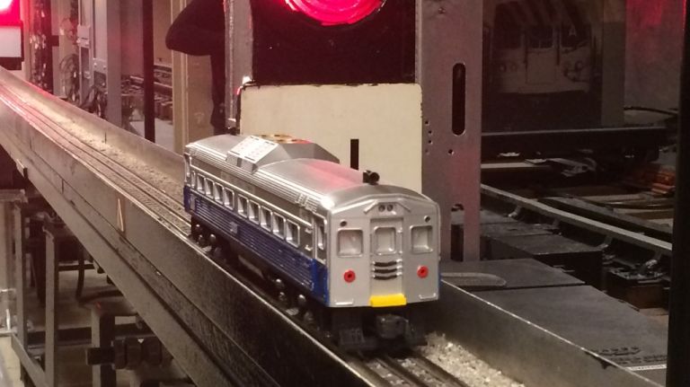 NYC's subway signal system: How it keeps trains from colliding and other things you probably never knew 10 Using that cute model train, Habersham showed how a track circuit failure can make it appear as if a red light has been triggered by a train even though one is not even nearby. These phantom trains trigger a red light for the train behind it. To ensure the safety of the train and its passengers, that following train will only proceed at about 10 mph (normal speed is about 35 mph) after getting permission from the rail control center. The track circuit failure inevitably creates a backup of train traffic until dispatch can get someone out to check out what is causing the phantom train. Sometimes, it ends up being nothing more than an aluminum can on the tracks.