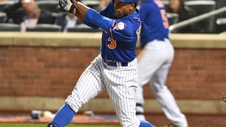 New York Mets right fielder Curtis Granderson (3) smacks a two-run double in the 7th inning as the Mets play the. Dodgers at Citi Field in Queens during Game 3 of the NLDS on Monday, Oct. 12, 2015.
