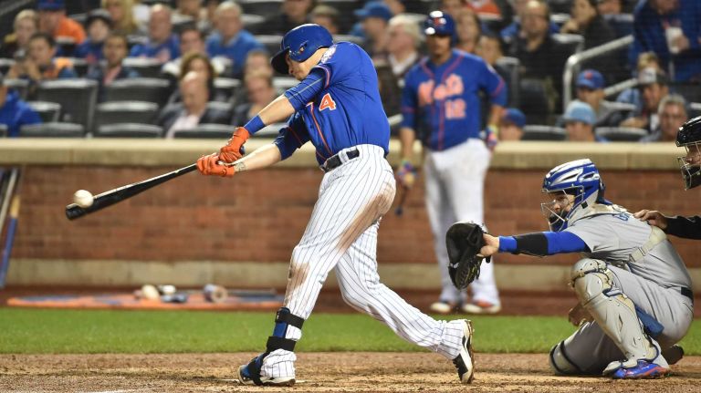 New York Mets shortstop Wilmer Flores (4) smacks a double in the fifth inning during Game 3 of the NLDS against the Los Angeles Dodgers on Monday, Oct. 12, 2015.
