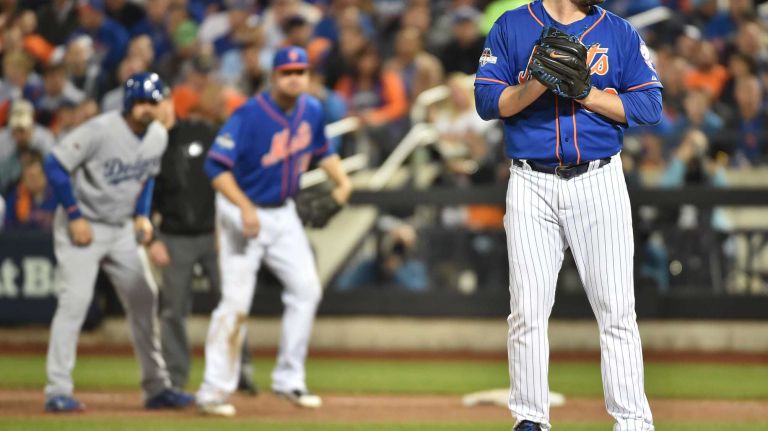 New York Mets starting pitcher Matt Harvey (33) gets set to deliver a pitch in the fifth inning during Game 3 of the NLDS against the Los Angeles Dodgers on Monday, Oct. 12, 2015.