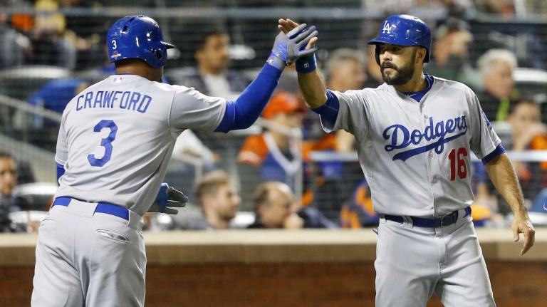 Andre Ethier #16 and Carl Crawford #3 of the Los Angeles Dodgers both score in the second inning against the New York Mets at Citi Field in the Queens during Game 3 of the NLDS on Monday, Oct. 12, 2015
