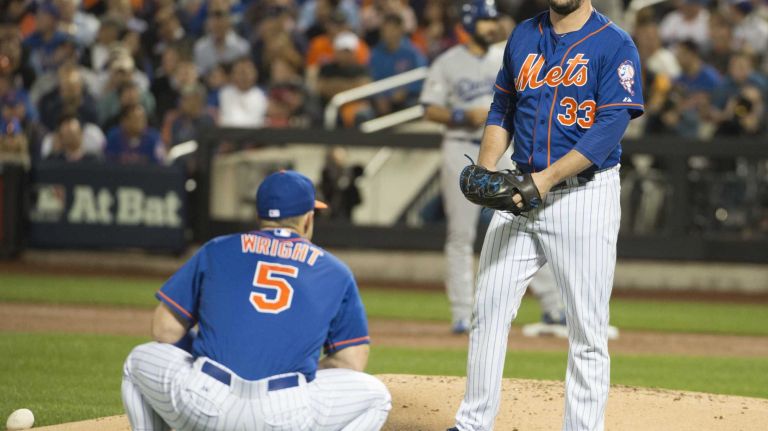 New York Mets third baseman David Wright (5) talks with Mets starting pitcher Matt Harvey (33) in the second inning of Game 3 of the NLDS against the Los Angeles Dodgers on Monday, Oct. 12, 2015.