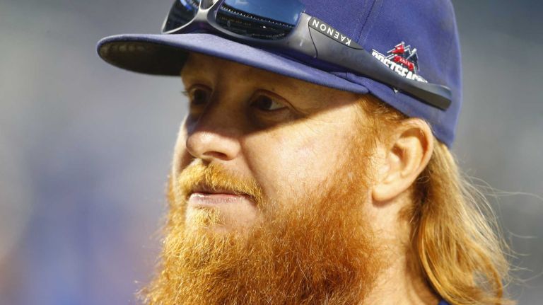 Los Angeles Dodgers third baseman Justin Turner looks on during warmups as ahead of Game 3 of the NLDS against the New York Mets on Monday, Oct. 12, 2015.