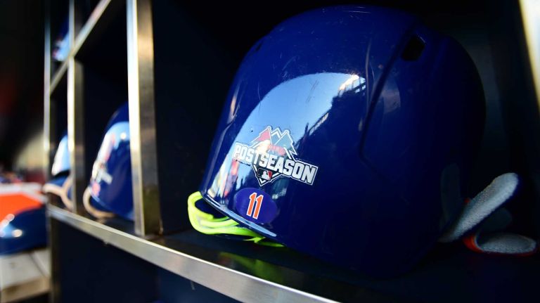 Ruben Tejada's helmet is seen in the helmet rack in the dugout before Game 3 of the NLDS against the Los Angeles Dodgers at Citi Field on Monday, Oct. 12, 2015.