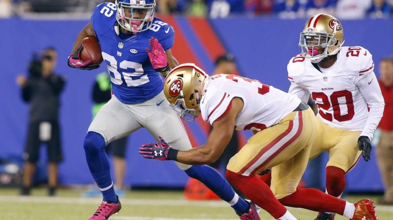 Rueben Randle #82 of the New York Giants runs after making a reception in the first half against Eric Reid #35 of the San Francisco 49ers at MetLife Stadium on Sunday, Oct. 11, 2015 in East Rutherford, N.J.