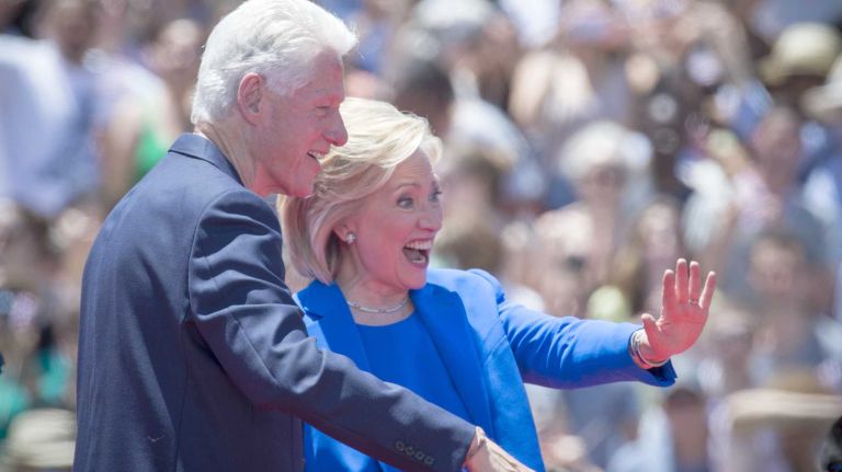 Democratic presidential hopeful Hillary Rodham Clinton and her husband, former president Bill Clinton, are surprised to see some in the crowd during the official kickoff of her campaign from Franklin D. Roosevelt Four Freedoms Park on Roosevelt Island in New York City Saturday, June 13, 2015.