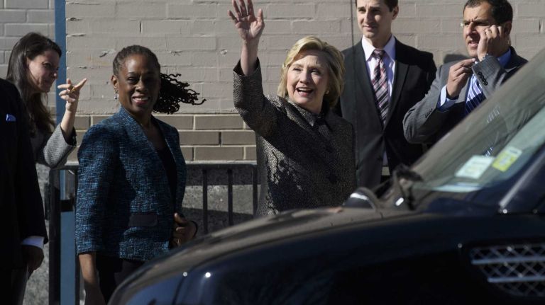 Former Secretary of State Hillary Rodham Clinton waives to a pedestrian after announcing with New York City First Lady Chirlane McCray, the 