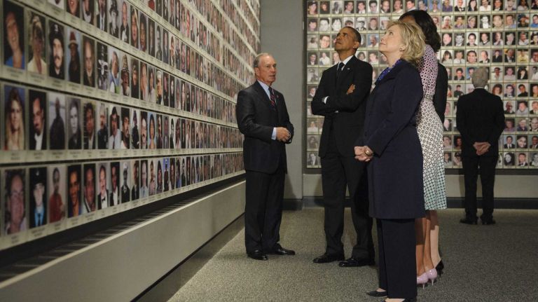 Former New York City Mayor and National September 11 Memorial & Museum Chairman Michael Bloomberg shows President Barack Obama, former U.S. Secretary of State Hillary Clinton, first lady Michelle Obama, Diana Taylor, and former President Bill Clinton the memorial exhibition in the south tower footprint at the National September 11 Memorial Museum at the World Trade Center site in Manhattan on Thursday, May 15, 2014.