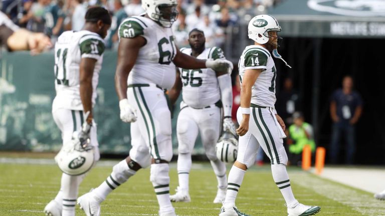 Ryan Fitzpatrick #14 of the New York Jets walks to the bench after throwing an interception in the fourth quarter against the Philadelphia Eagles at MetLife Stadium on Sunday, Sep. 27, 2015 in East Rutherford, New Jersey.