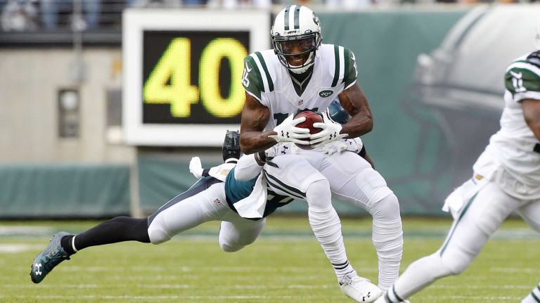 Brandon Marshall #15 of the New York Jets runs a reception in the first half against Malcolm Jenkins #27 of the Philadelphia Eagles during an NFL game at MetLife Stadium on Sept. 27, 2015.