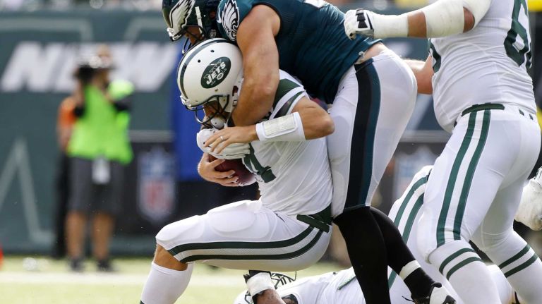 Ryan Fitzpatrick #14 of the New York Jets is sacked in the second quarter by Connor Barwin #98 of the Philadelphia Eagles at MetLife Stadium on Sunday, Sep. 27, 2015 in East Rutherford, New Jersey.