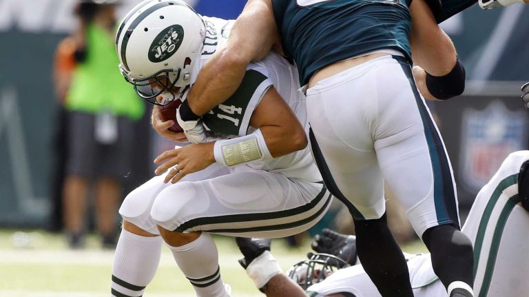 Ryan Fitzpatrick #14 of the New York Jets is sacked in the second quarter by Connor Barwin #98 of the Philadelphia Eagles at MetLife Stadium on Sunday, Sep. 27, 2015 in East Rutherford, New Jersey.