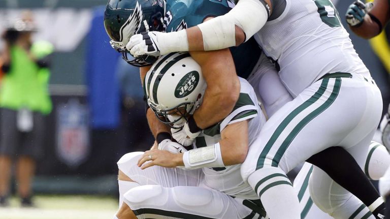 Ryan Fitzpatrick #14 of the New York Jets is sacked in the second quarter by Connor Barwin #98 of the Philadelphia Eagles at MetLife Stadium on Sunday, Sep. 27, 2015 in East Rutherford, New Jersey.