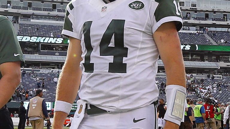 Ryan Fitzpatrick #14 of the New York Jets walks off the field after a loss against the Philadelphia Eagles during an NFL game at MetLife Stadium on Sept. 27, 2015.