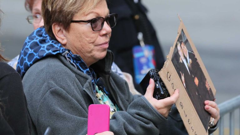 Anna Florentino of Malverne holds a photo of her nephew, 34-year-old Charles Lucania of East Atlantic Beach, who was killed on 9/11, as she awaits Pope Francis' arrival at the National September 11 Memorial & Museum in Manhattan on Friday, Sept. 25, 2015. Florentino joined other families of 9/11 victims and first responders as the pope prayed near the south tower memorial pool.