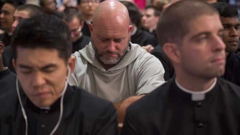 The faithful await the arrival of Pope Francis for evening prayer services at St. Patrick's Cathedral in Manhattan on Thursday, Sept. 24, 2015.