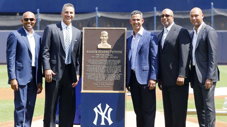 Andy Pettitte poses for a photograph with his Monumment Park plaque along side former teammates, from left, Mariano Rivera, Jorge Posada, Bernie Williams and Derek Jeter before the Yankees play against the Cleveland Indians at Yankee Stadium on Sunday, Aug. 23, 2015.