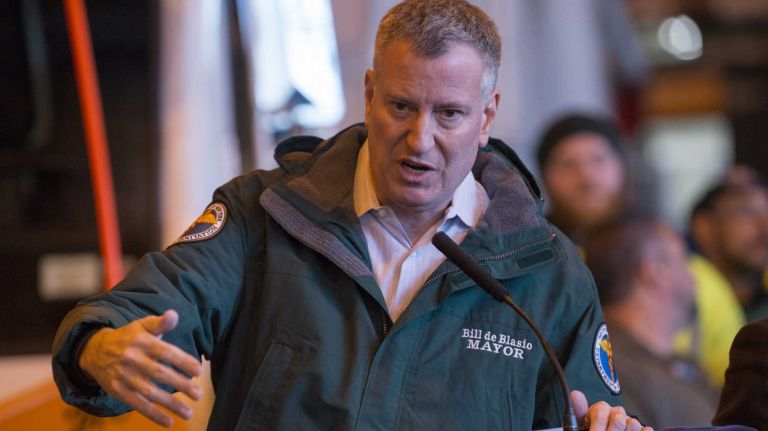 Mayor Bill de Blasio, at a news conference on Sunday, Jan. 25, 2015, at the Sanitation Department garage on Bloomfield Street in Manhattan, urges New Yorkers to get off the streets before the winter storm reaches its peak.